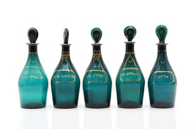 Lot 221 - Five Regency green glass decanters and stoppers