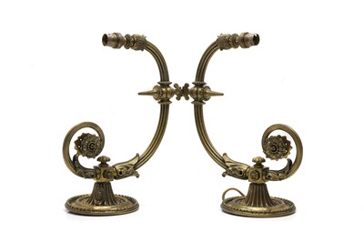 Lot 493 - A pair of cast scrolling wall lights