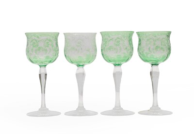 Lot 217A - A near set of four cased and intaglio cut wine glasses