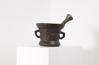 Lot 250 - A bronze mortar and associated pestle