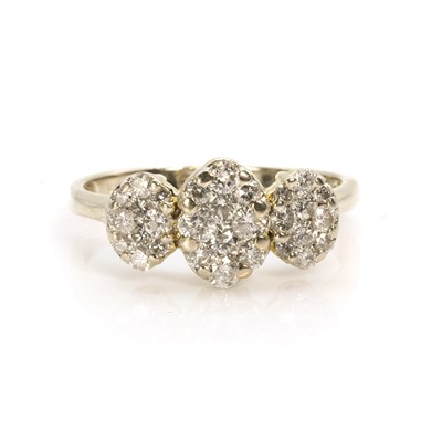 Lot 59 - A white gold diamond triple cluster ring