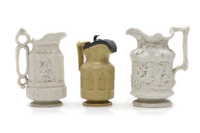 Lot 81 - A group of three Gothic Revival earthenware jugs