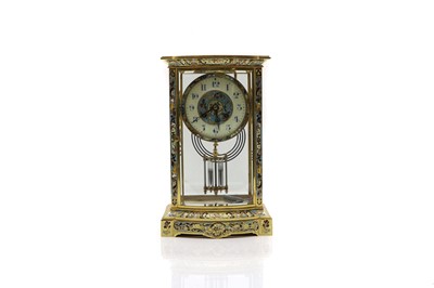 Lot 238 - A lacquered brass and champleve enamel mantel clock