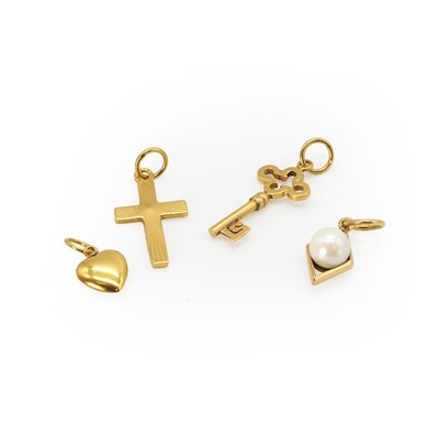 Lot 338 - A small group of gold charms