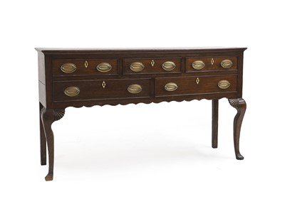 Lot 523 - A George III oak dresser
