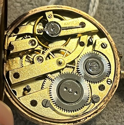 Lot 34 - A 9ct gold ladies top wind open faced fob watch