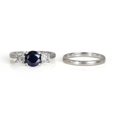 Lot 247 - A platinum sapphire and diamond three stone ring