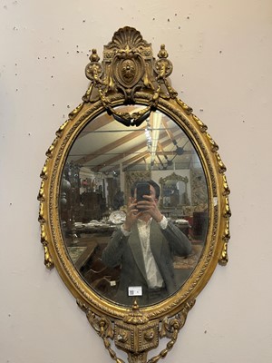 Lot 1 - A pair of carved giltwood and gesso girandole mirrors