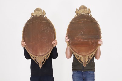 Lot 1 - A pair of carved giltwood and gesso girandole mirrors