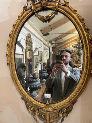 Lot 1 - A pair of carved giltwood and gesso girandole mirrors