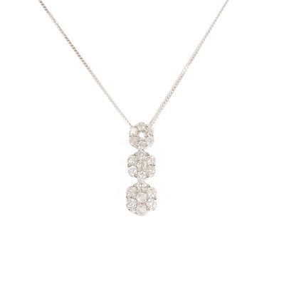 Lot 64 - A white gold diamond triple cluster pendant