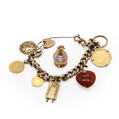 Lot 447 - A charm bracelet