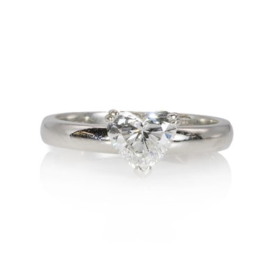 Lot 102 - A platinum and heart shaped diamond single stone ring