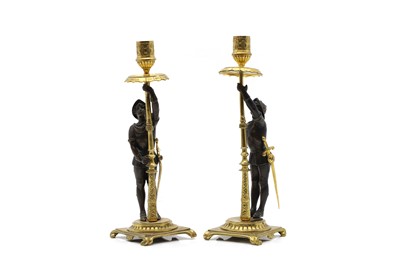 Lot 489 - A pair of gilt metal figural candlesticks