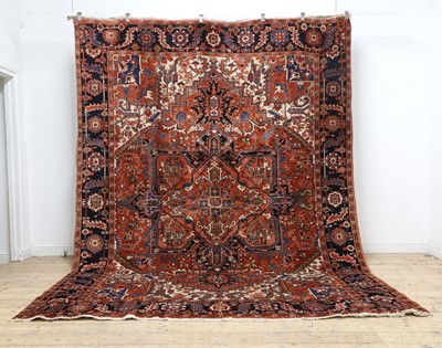 Lot 635 - A Heriz wool carpet