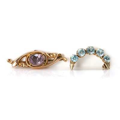 Lot 291 - An Edwardian amethyst brooch and a blue zircon crescent brooch