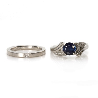 Lot 267 - A platinum sapphire and diamond ring and a platinum band ring