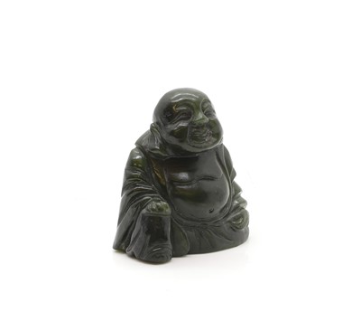 Lot 267 - A sage green jade buddha
