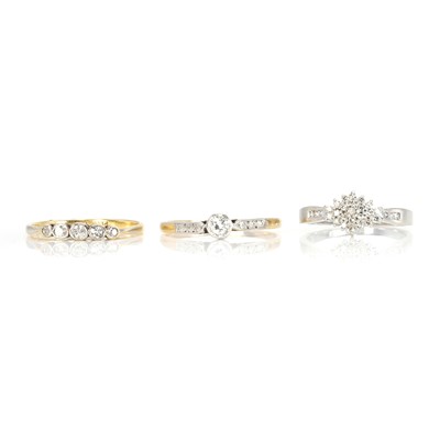 Lot 317 - A group of three diamond set rings