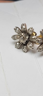 Lot 178 - A pair of diamond flower stud earrings