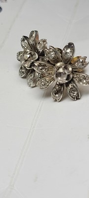 Lot 178 - A pair of diamond flower stud earrings