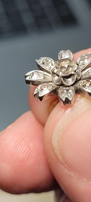 Lot 178 - A pair of diamond flower stud earrings