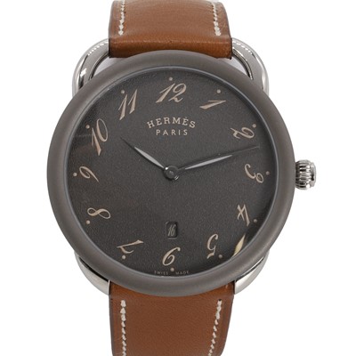 Lot 435 - A gentlemen's stainless steel and titanium Hermès Arceau quartz strap watch