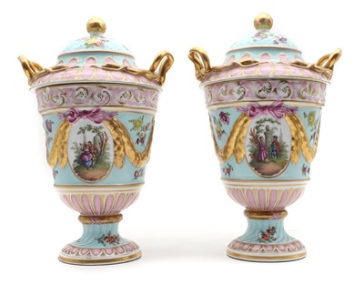Lot 327 - A pair of Dresden porcelain urns and covers