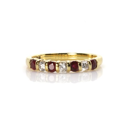 Lot 98 - An 18ct gold ruby and diamond seven stone ring
