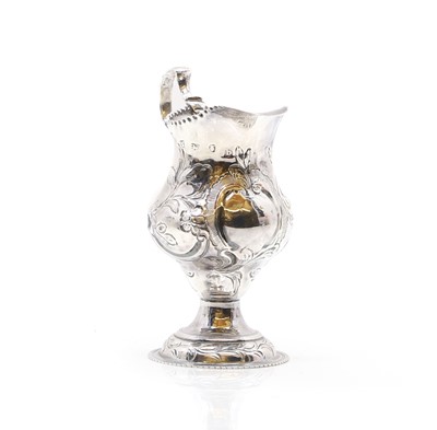 Lot 16 - A George III silver cream jug