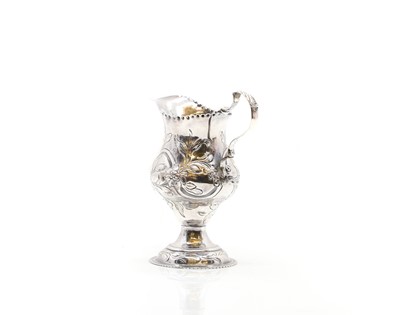 Lot 16 - A George III silver cream jug