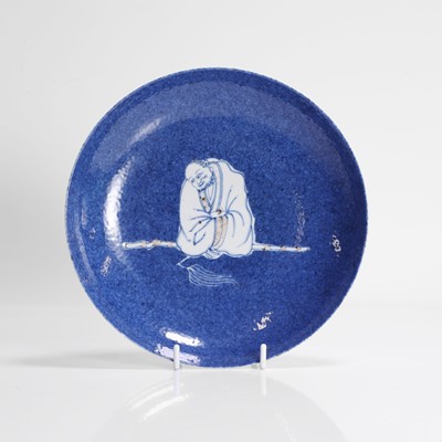 Lot 44 - A Chinese copper-red and underglaze blue plate