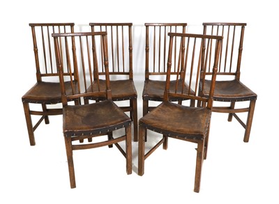 Lot 671 - A set of six oak dining chairs
