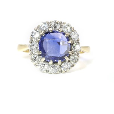 Lot 62 - A Ceylon sapphire and diamond cluster ring