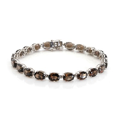 Lot 1235 - A 9ct white gold single row smoky quartz bracelet