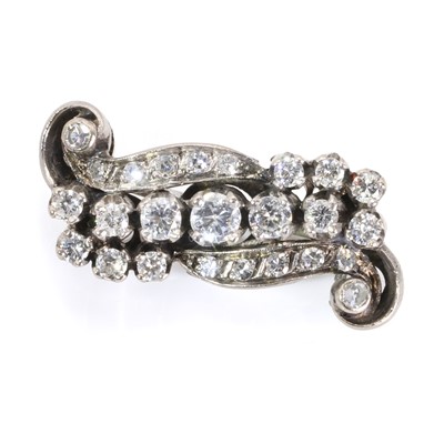 Lot 101 - A diamond set scroll brooch