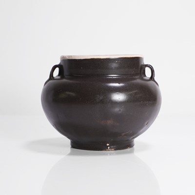 Lot 12 - A Chinese black-glazed jar