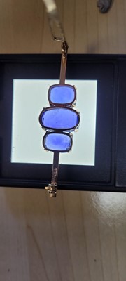 Lot 104 - A sapphire three stone bar brooch