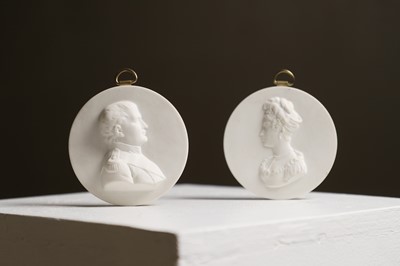 Lot 167 - A pair of biscuit porcelain medallions