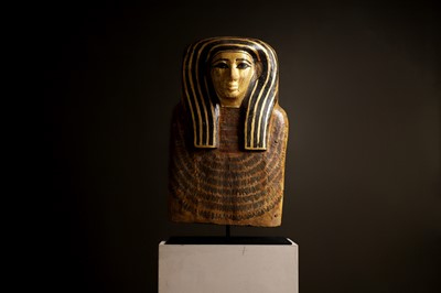 Lot 279 - An Egyptian painted wood sarcophagus or coffin lid