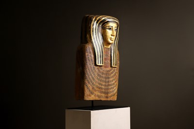 Lot 279 - An Egyptian painted wood sarcophagus or coffin lid