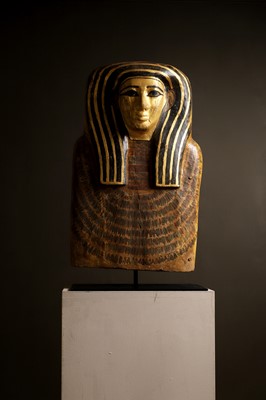 Lot 279 - An Egyptian painted wood sarcophagus or coffin lid