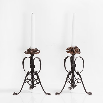Lot 386 - A pair of Aesthetic wrought-iron candlesticks