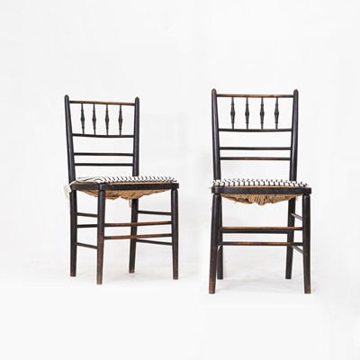 Lot 384 - A pair of Arts and Crafts ebonised beech side chairs