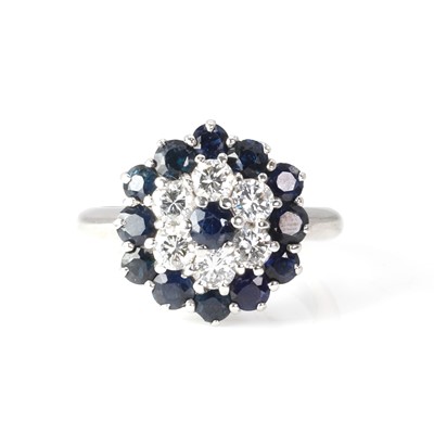 Lot 168 - A white gold sapphire and diamond target cluster ring