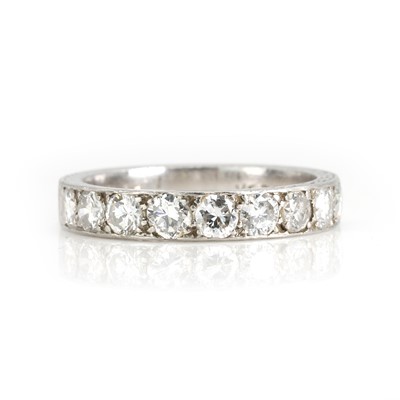 Lot 229 - A platinum and diamond half eternity ring