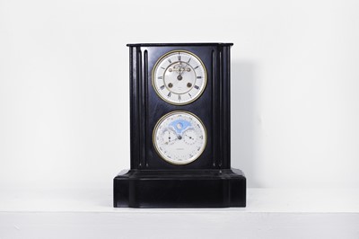Lot 662 - A polished slate mantel clock