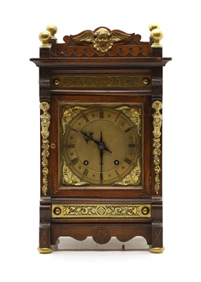 Lot 397 - A eight day mantel oak and gilt-brass clock by Winterhalder-Hofmeier