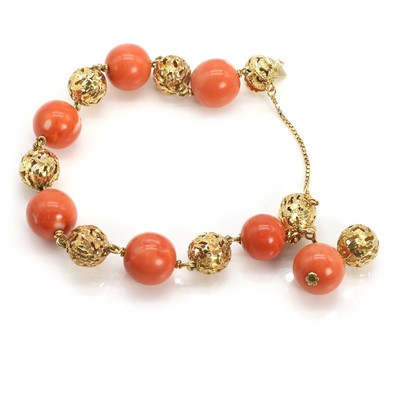 Lot 110 - A French gold coral bead bracelet
