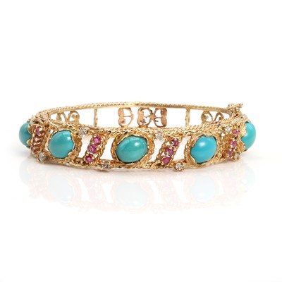 Lot 300 - A turquoise, ruby and diamond hinged bangle